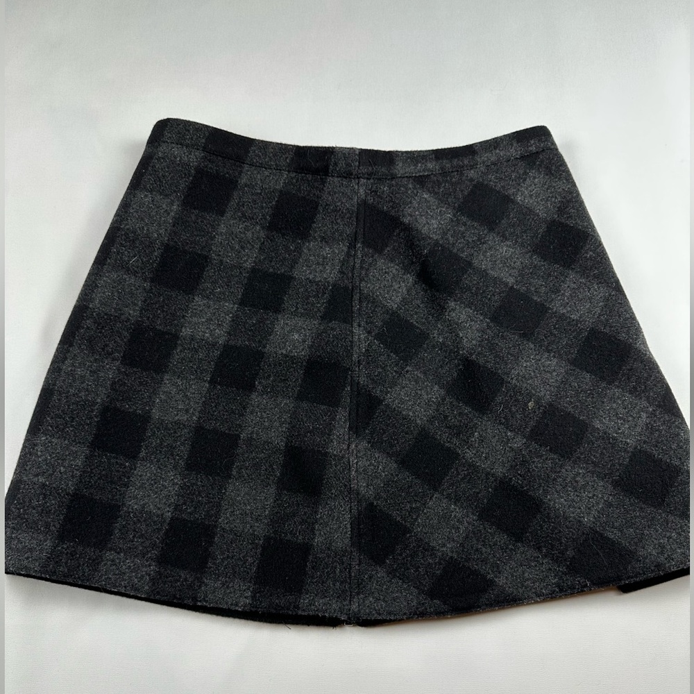 No brand thick wool like black plaid faux wrap zip up skirt. See measurements.